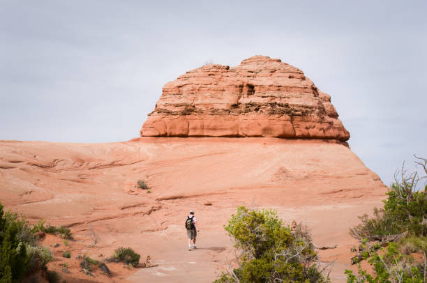 Man hiking in Arches National Park. Utah.