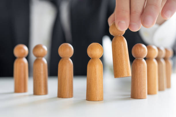 istock Hand select or choose a person as leader to team 2167122945