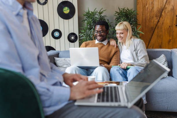 istock Cheerful diverse young coworkers chatting in modern co-working space 2167122952