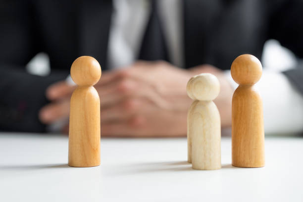 istock Wooden people on the table in the office 2167123091