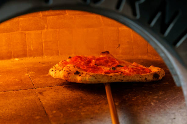 istock Putting pizza in an Italian pizza oven 2167123353