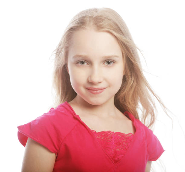 Portrait of a beautiful girl at a traveling carnival and looking at the camera smiling - lifestyle concept