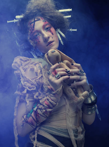 istock Young woman with creative make up holding little rabbit. 2167126295