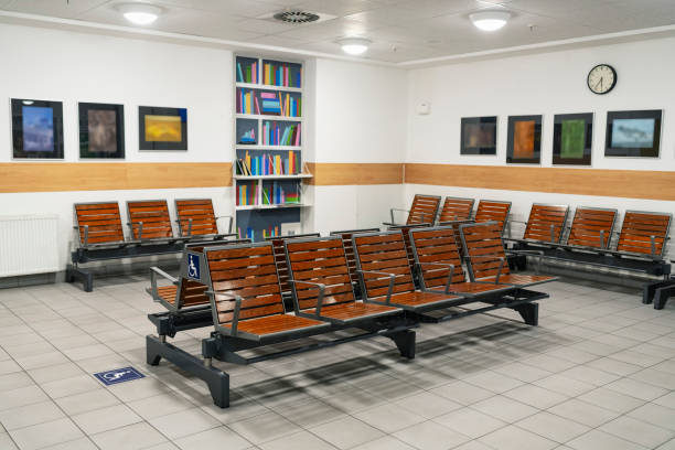 Empty waiting room at the station, benches with backs