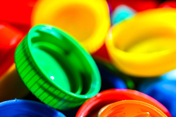 Different sorts of colorful plastic bottle caps. Recycling.