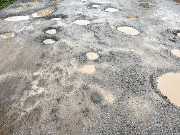 istock Rural roads are bumpy, waterlogged, and damaged. 2167131705