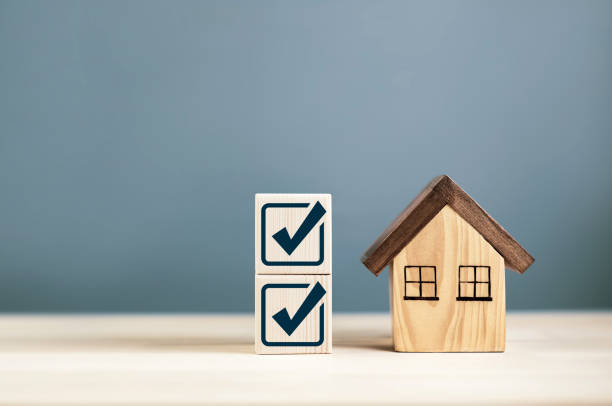 istock Check mark with wooden house 2167132434