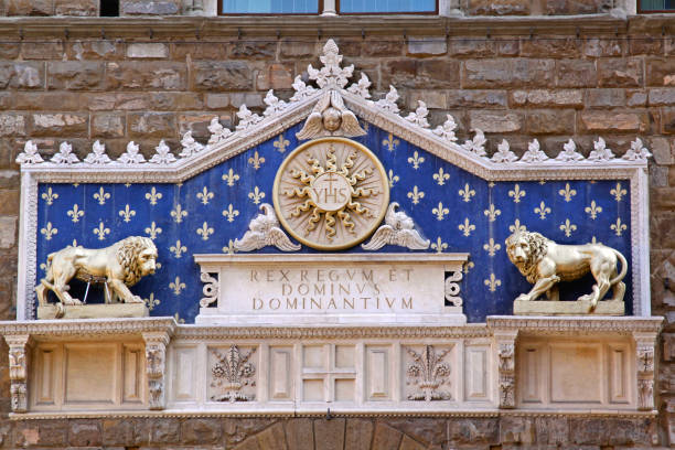 Florence, Italy - September 28, 2009: Latin Script Yhs With Marble Lions at Entrance to Palazzo Vecchio Historic Landmark Museum Building.