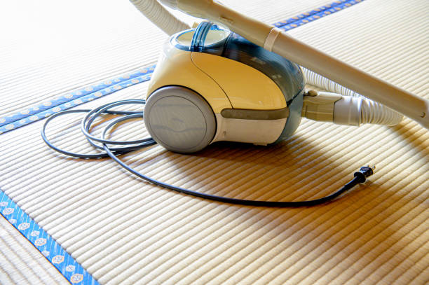 Rotative brush of a vacuum cleaner,  on pvc parquet, imitation wood.