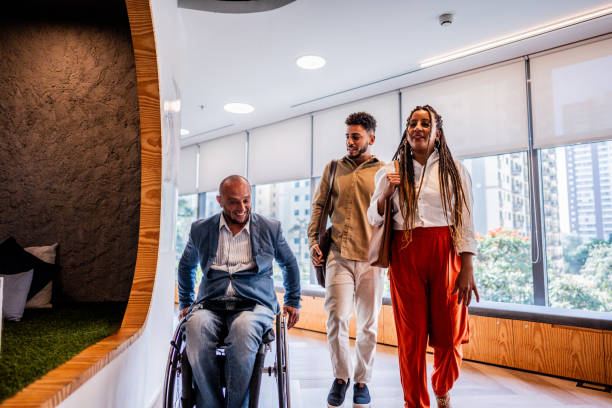 istock Colleagues talking on the corridor of office 2167140454