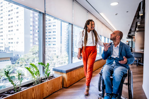 istock Colleagues talking on the corridor of office 2167140471