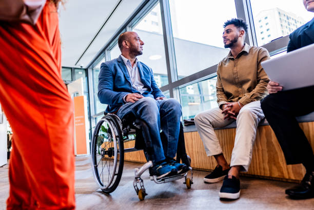 istock Colleagues talking on the corridor of office 2167140663