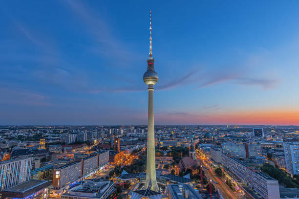 istock illuminated television tower in Berlin in the evening 2167141761