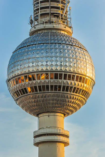 Berlin television tower in the evening sun. Sphere of the tallest building in Germany. Landmark in the capital of Germany. reflections of the sun's rays on the mirrored rows of windows