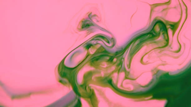 Abstract pink and green liquid Ink paint swirls
