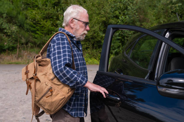 istock Mature man opening a car door 2167145644