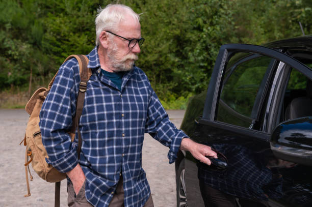 istock Retired man opening a car door 2167145666