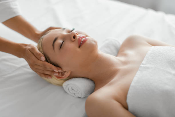 istock Young Woman Enjoying a Relaxing Head Massage 2167146069