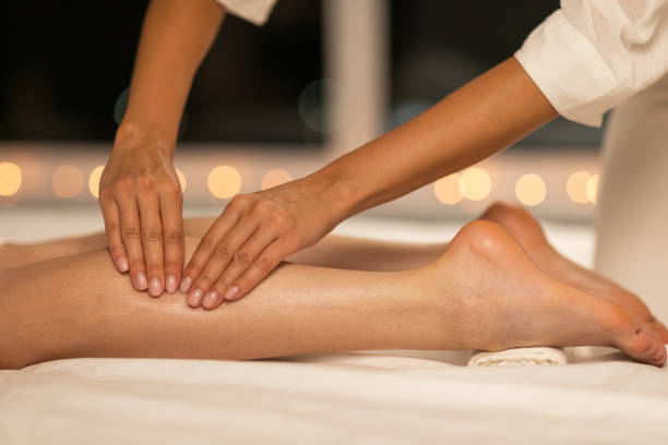 istock Professional Therapist Giving Relaxing Leg Massage in Serene Spa Setting 2167146186