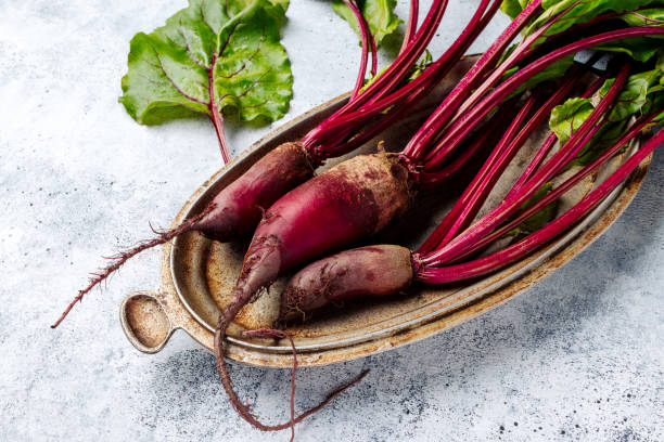 istock Fresh raw beets with leaves on a rustic metal dish on a gray background 2167147033