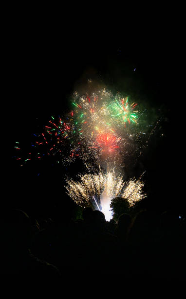 istock Fireworks. 
Group of people watching the fireworks. 2167149125