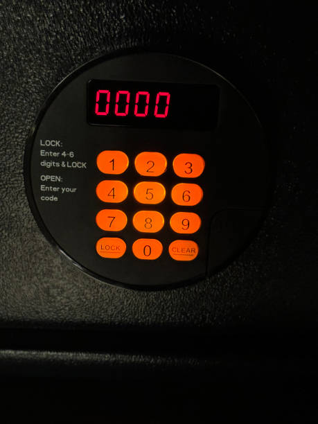 Stock photo features a hotel safe equipped with a digital keypad, showcasing a predictable code of 0000 for easy access. The secure system uses numeric digits for a straightforward locking mechanism, providing reliable security for personal belongings. Ideal for travelers, this hotel safe combines simplicity with protection