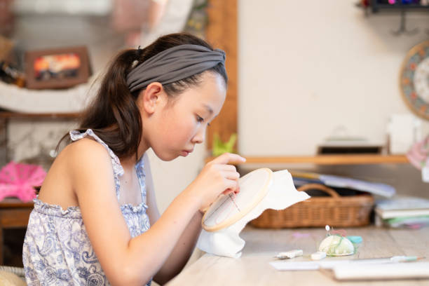 istock Girl doing embroidery 2167152084