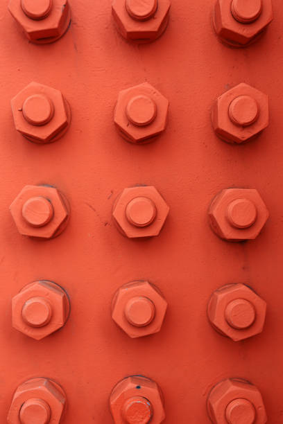 Metal nut on gray background. Construction materials. Industrial equipment. Tools in the workshop. Top view. 3d render