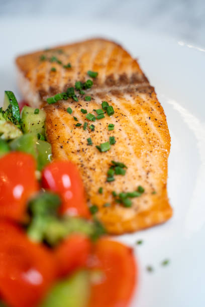 istock Grilled cut salmon fish with salad. 2167156072