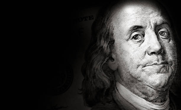 istock Close up American one hundred dollar bill background 2167156441