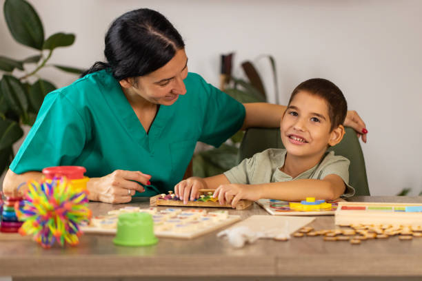 istock Nurse Engaging Boy with Autism 2167161129