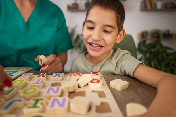 istock Nurse Teaching Autism Alphabet 2167161351