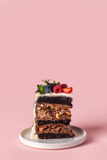 Slice of chocolate cake with berries.