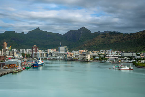 Exposure of Port Louis at Sunrise, taken from a Cruise Ship, showing the city center and the port, hub port on the Indian Ocean island of Mauritius