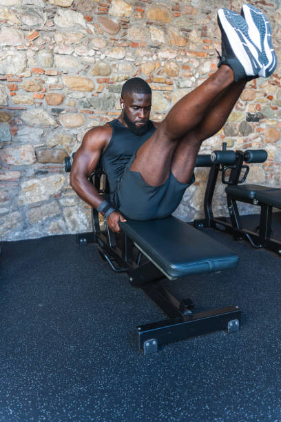 istock Black athlete working abs on the gym bench 2167166514