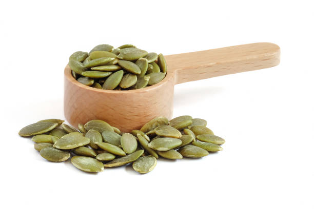 istock Pumpkin seeds close up on white background. 2167166931