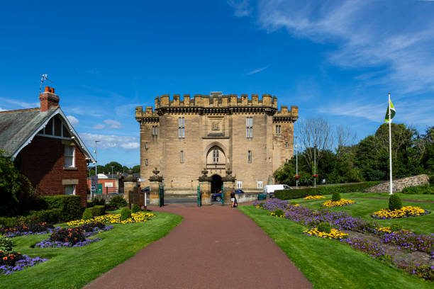 Alnwick, Northumberland, England/July 18, 2018: a view of the back entryway to historic Alnwick Castle, a famed film location and the second largest inhabited castle in England