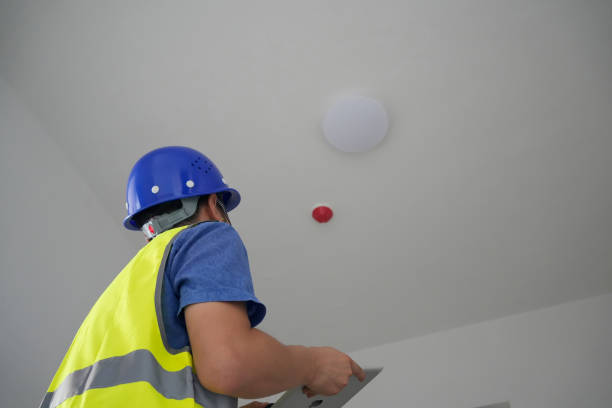 The man inspects the house. Contractor, Inspector