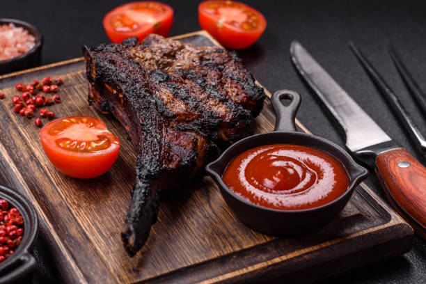 istock Juicy grilled beef tomahawk steak with salt, spices and herbs 2167173831