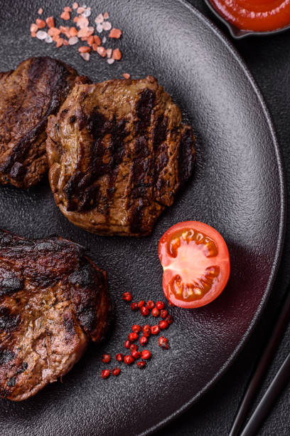 istock Juicy grilled beef tomahawk steak with salt, spices and herbs 2167173856