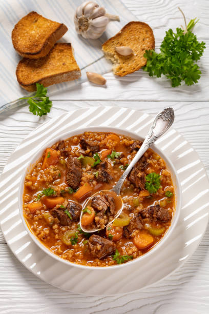 istock beef barley soup in a bowl, top view 2167174610