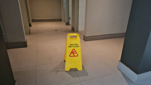 istock Caution sign indicating wet floor in a hallway during daytime 2167174937