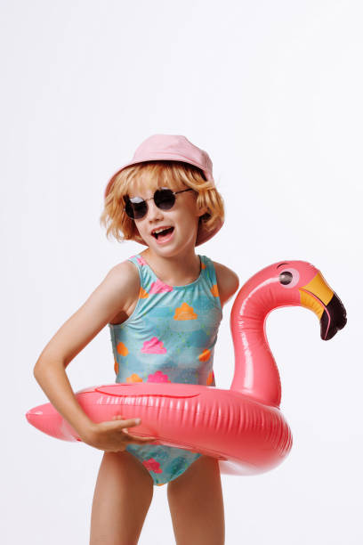 istock Child with inflatable duck ring on blue background with copy space. 2167178592