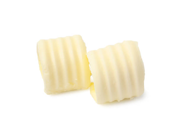 istock Two tasty butter curls isolated on white 2167182728