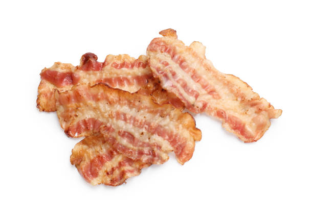 Delicious fried bacon slices isolated on white, top view
