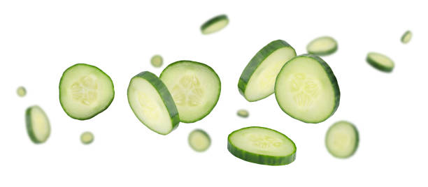 istock Sliced cucumbers fly and levitate in space. Isolated on white 2167187253