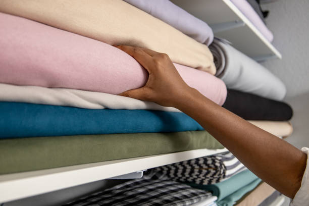 istock Unrecognizable woman designer choosing materials in fabric store 2167188580