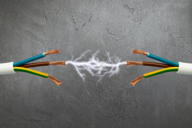 istock Exposed Electrical Wires Sparking with Electricity on Gray Background 2167190028