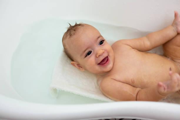 happy baby enjoying a bath