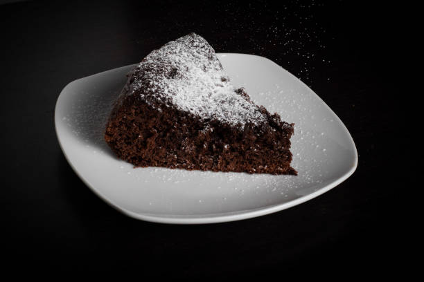 istock Chocolate Cake Slice with Powdered Sugar on White Plate 2167190850